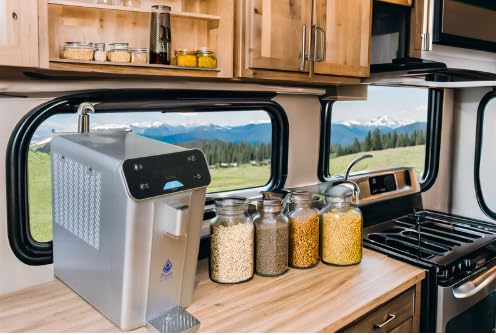 Kitchen setup inside a recreational vehicle with an Atmospheric Water Generator